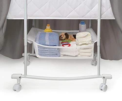 Wishes Oval Rocking Baby Bassinet With Bedding, Storage, And Pad - Image 4
