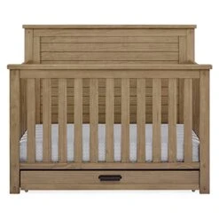 Delta Children Simmons Kids Caden 6-in-1 Convertible Crib With Trundle Drawer, Greenguard Gold Certified, Rustic Acorn